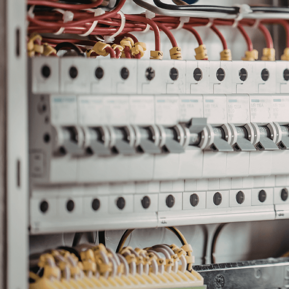 Close-up of electrical wiring and circuit breakers for garage door operator system