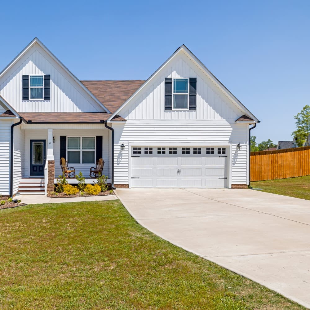 Residential home exterior with garage doors